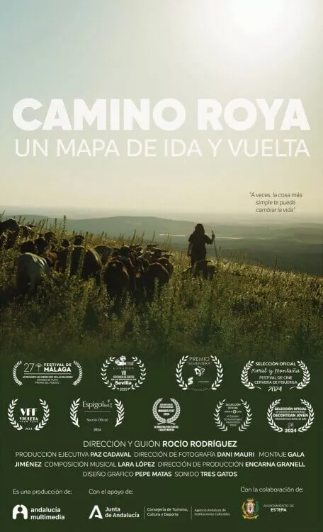 Αφίσα ταινίας "Camino Roya. Un mapa de ida y vuelta." Δείχνει έναν βοσκό με μπαστούνι να οδηγεί ένα κοπάδι κατσίκες σε μια πράσινη πλαγιά κάτω από έναν φωτεινό ουρανό. Ο τίτλος της ταινίας είναι στην κορυφή, με βραβεία και συντελεστές από κάτω.